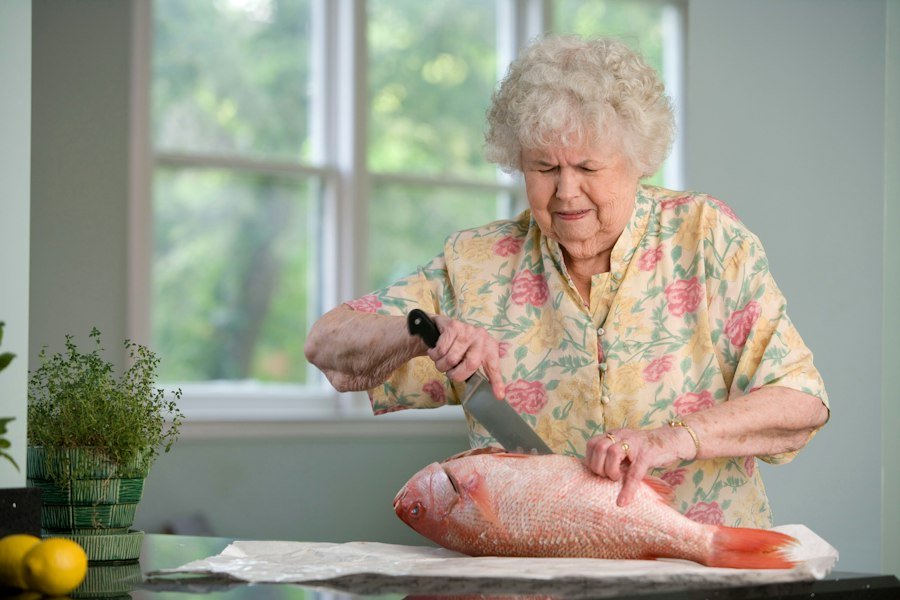 Caregiver smiling with senior gentleman